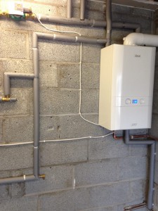 Fit heat only boiler for unvented in the garage and run to cold feed and open vent back to the boiler  